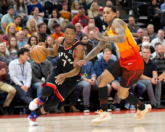 Jordan Clarkson (00) takes on Kyle Lowry (7) in a matchup between the Jazz and Raptors